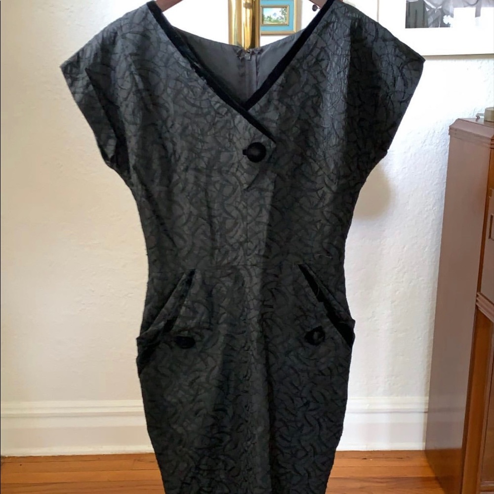 Vintage black dress with velvet details.